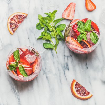 Orange and strawberry summer Sangria with fresh mint leaves