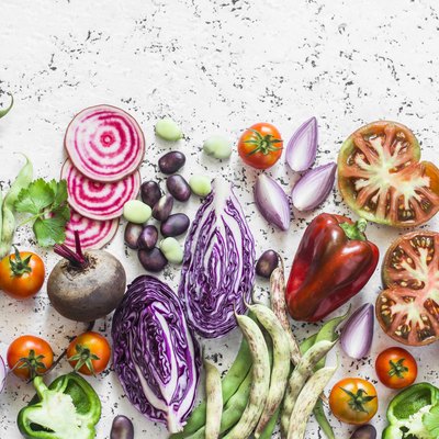 Organic fresh vegetables background. Cabbage, beets, beans, tomatoes, peppers on a light background, top view. Flat lay
