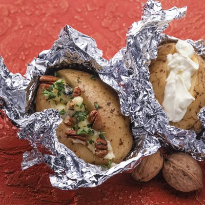 Baked potato with sea salt and walnuts and sour cream.