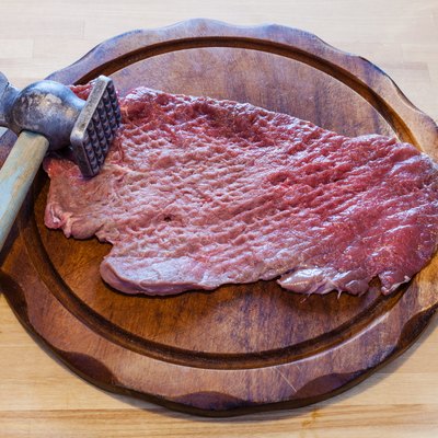 meat tenderizer and beaten slice of veal