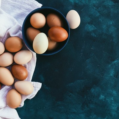 Farm fresh eggs on background, view from above.