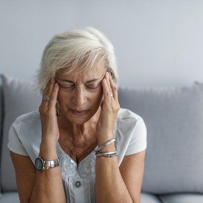 Woman having headache migraine