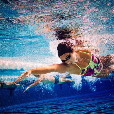 Swimmers doing freestyle in lane