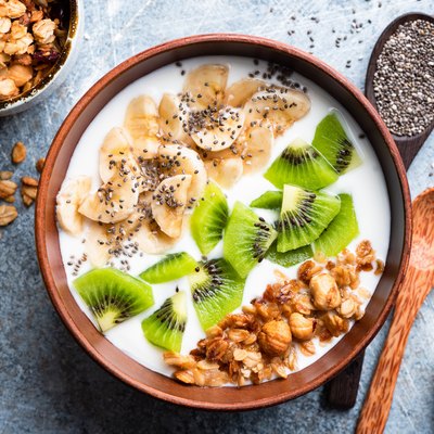 Tropical fruit bowl with granola and yogurt