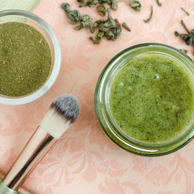 Homemade natural mask (scrub) with sea salt, olive oil and green tea. Diy cosmetics recipe. Top view, copy space