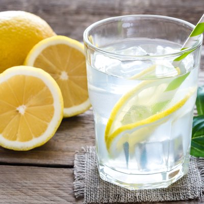 Glass of water with fresh lemon juice