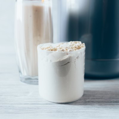 Close-up scoop with portion of dry protein powder