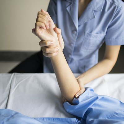 close up hand of therapist rehab physical therapy patient hand