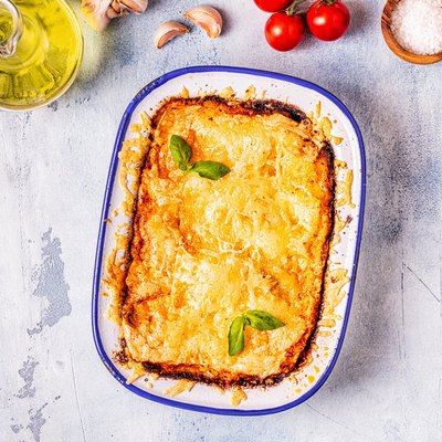 Traditional italian lasagna with vegetables, minced meat and cheese