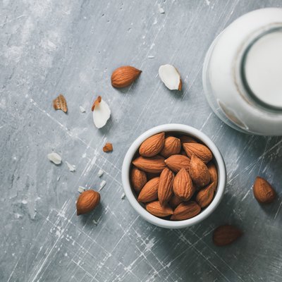 Directly Above Shot Of Almonds By Milk On Table