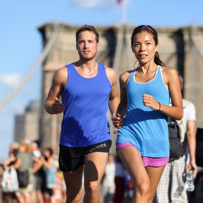 City running couple on Brooklyn bridge