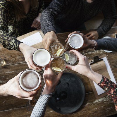 friends at a pub toasting
