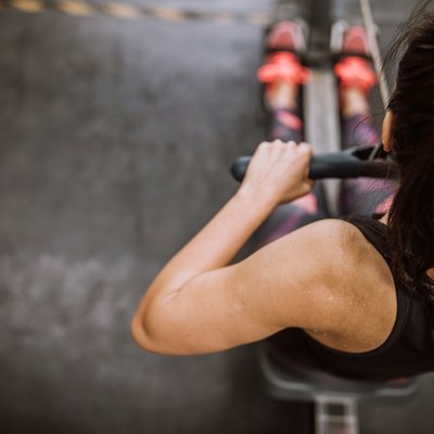 Woman Doing Workout Drill on Rowing Machine