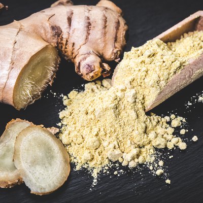 Ground ginger in a wooden scoop