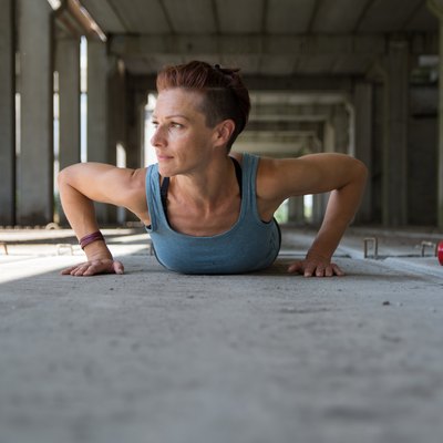 Girl doing push-up exercise outdoor