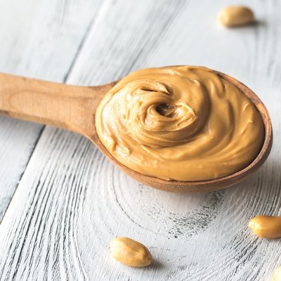 Wooden spoon of peanut butter