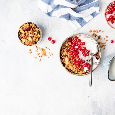 Granola bowl with yogurt and red currant berries