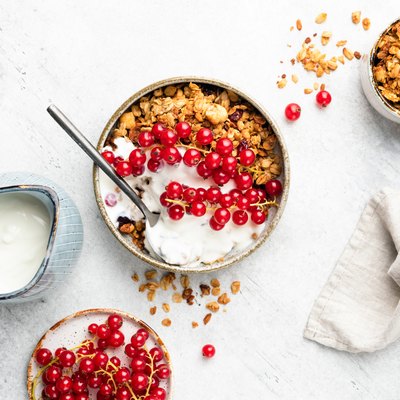 Oat granola with natural yogurt and red currant berries