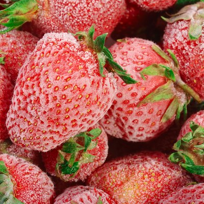 Frozen strawberries with frost on them