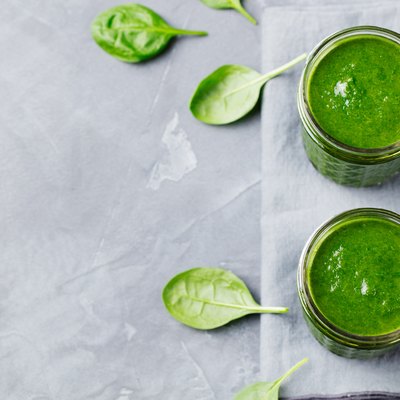 Spinach smoothie Healthy drink in glass jar. Top view