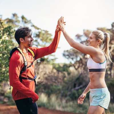 Athletic couple celebrating after the run