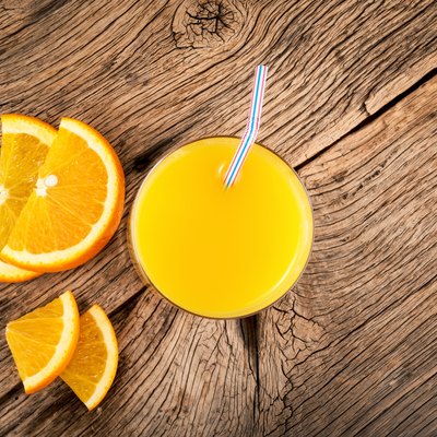 Orange juice in a glass. Citrus fruit drink