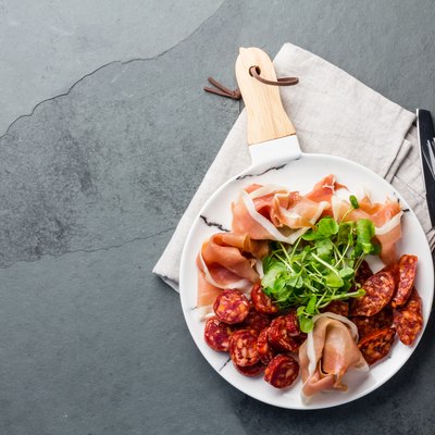 Plate of iberian spanish antipasto - ham serrano and salami