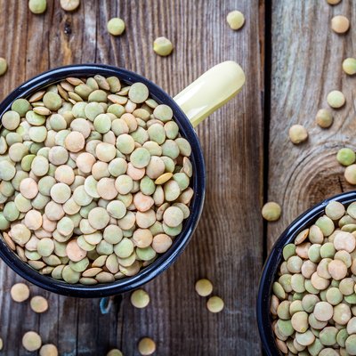 Mug with organic green lentils top view