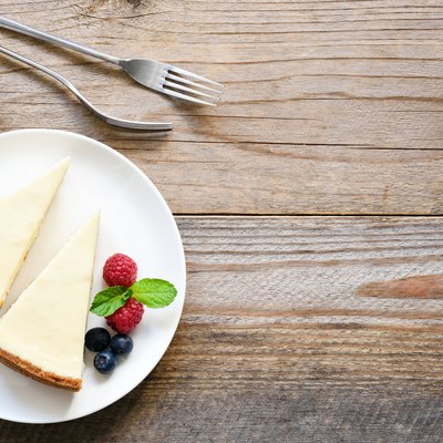 New York cheesecake or classic cheesecake with fresh berries on white plate