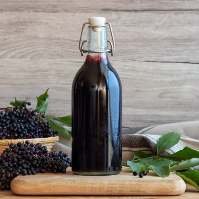 Black elder syrup, berries and leaves