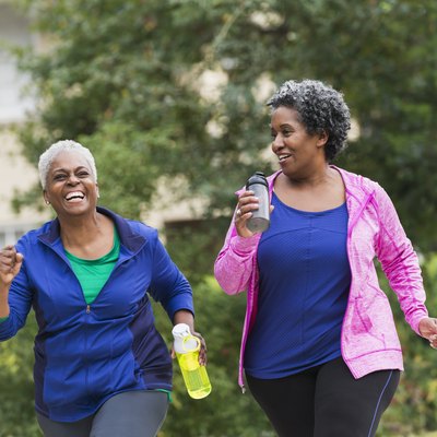 Two senior black women exercising together