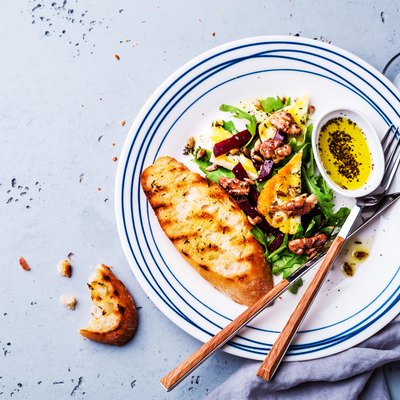 Salad - arugula (rucola), halloumi cheese, beetroot, walnuts and toast