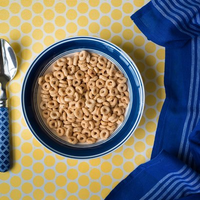 Bowl of cereal and blue kitchen towel