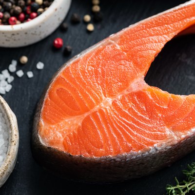 Raw salmon steak and spices