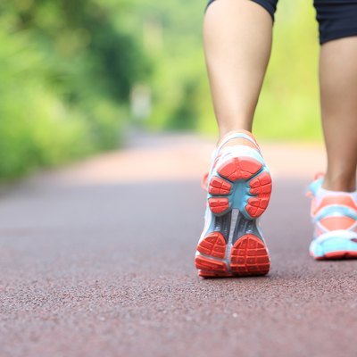young fitness woman runner /hiker legs at forest trail