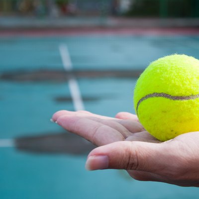Close-Up Of Woman Hand Holding Tennis Ball