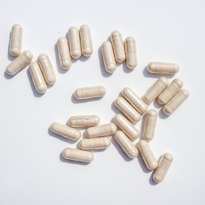 Directly Above Shot Of Capsules On White Background