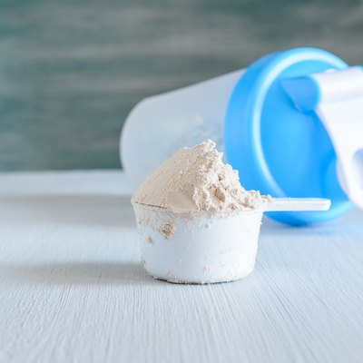 Scoop of protein and shaker. Sports nutrition.