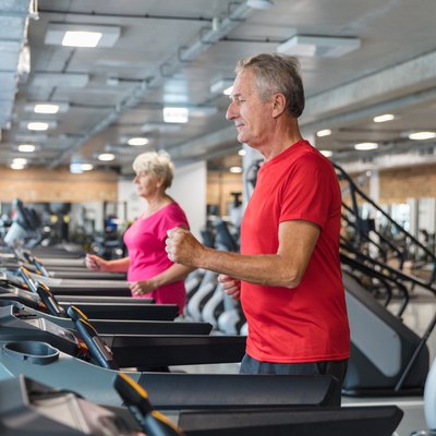 Senior people having rehabilitation at fitness club