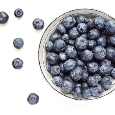 Directly Above Shot Of Blueberries Over White Background
