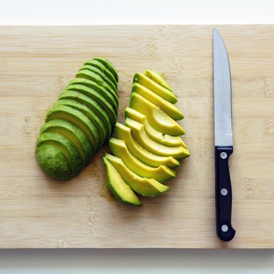 Freshly cut sliced avocado on a cutting board