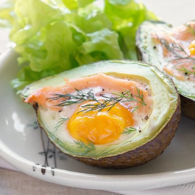 Baked smoked salmon, egg in avodaco, ketogenic keto low-carb diet food