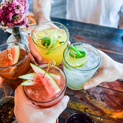 Friends toasting with healthy cocktails