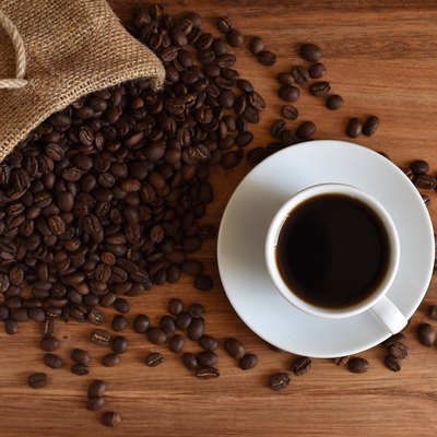 Close-Up Of Coffee Up With Beans On Table