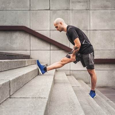Man Stretching With Achilles Tendon Pain