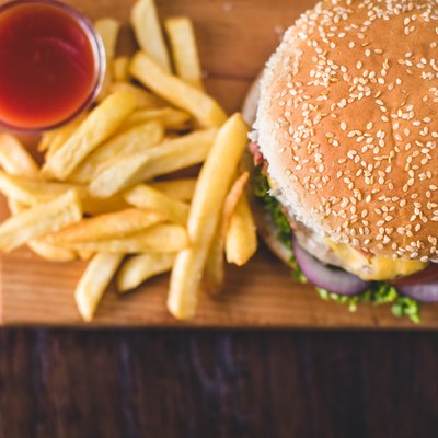 Homemade burgers on rustic wooden background