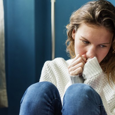 Young alone girl feeling sad