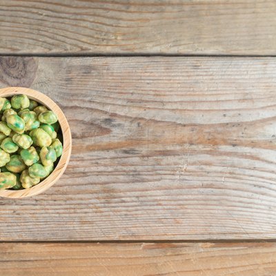 wasabi peas in wood cup. Top view.