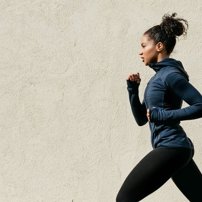 Woman Running Against Wall