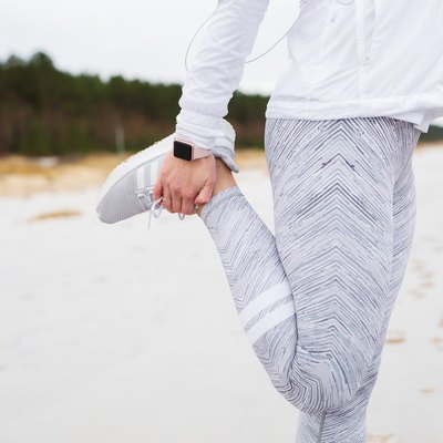 Woman stretching leg before run